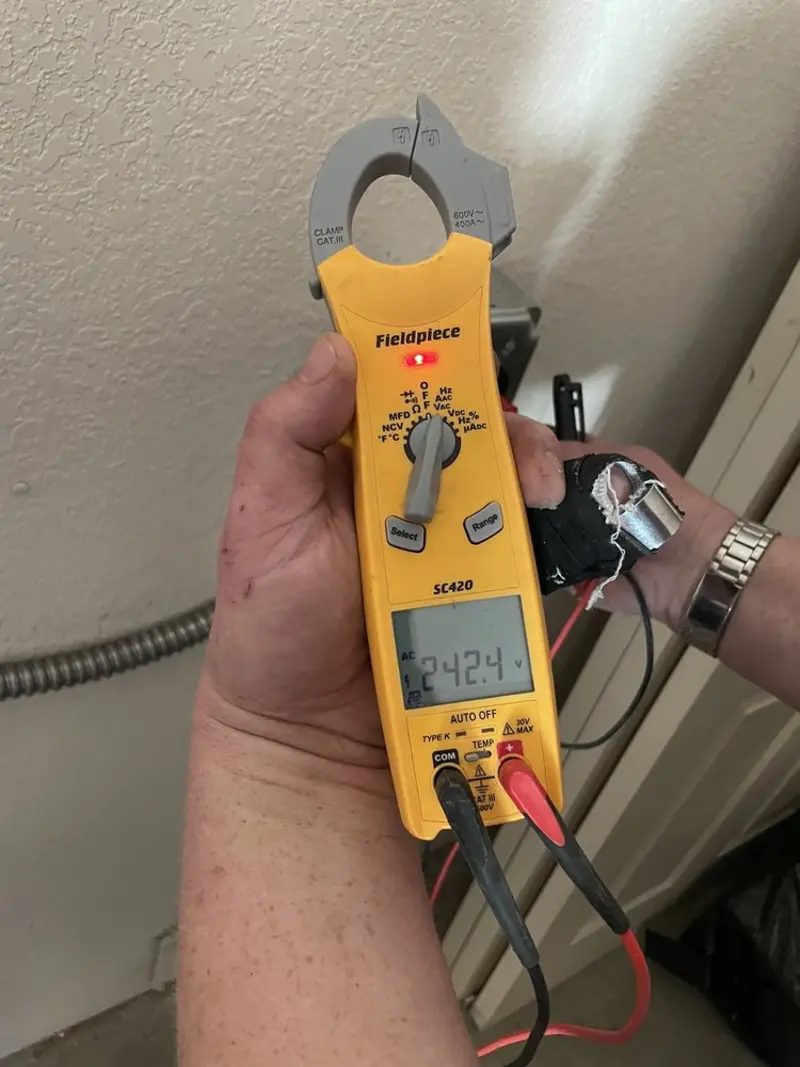 Voltage testing with clamp meter during Electrical Installation Services in New Canaan